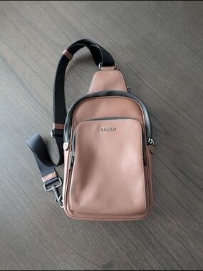 Coach Men's Blush Pink Leather Sling Bag with Black Strap